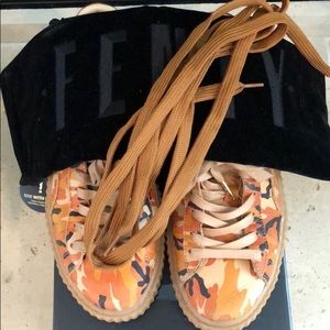 FENTI by Rihanna orange camo pumas